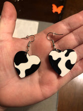 Load image into Gallery viewer, Cow Print Heart Dangle Earrings
